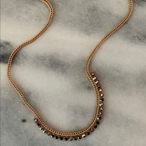 Gold necklace with gray stones